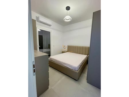 A 1+1 apartment is available for rent near the Red School.