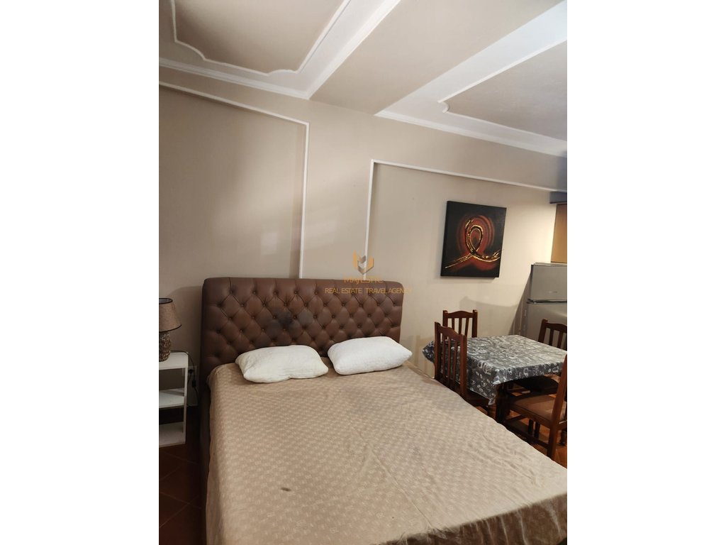 A studio apartment is available for rent near Petro Nini school, opposite the Deshmoret e Lirise high school.