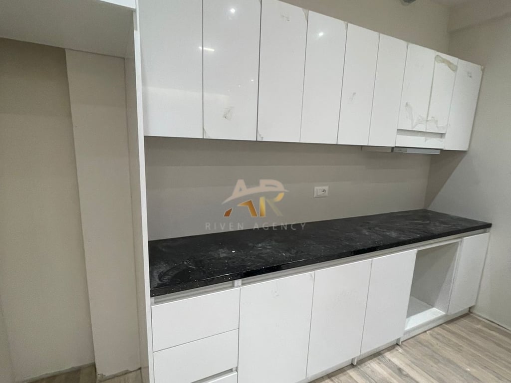A 1+1 apartment is for rent, unfurnished, in a newly completed building.