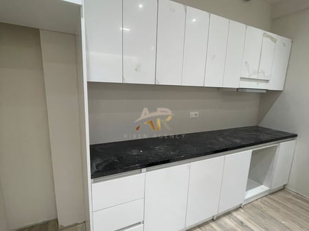 A 1+1 apartment is for rent, unfurnished, in a newly completed building.