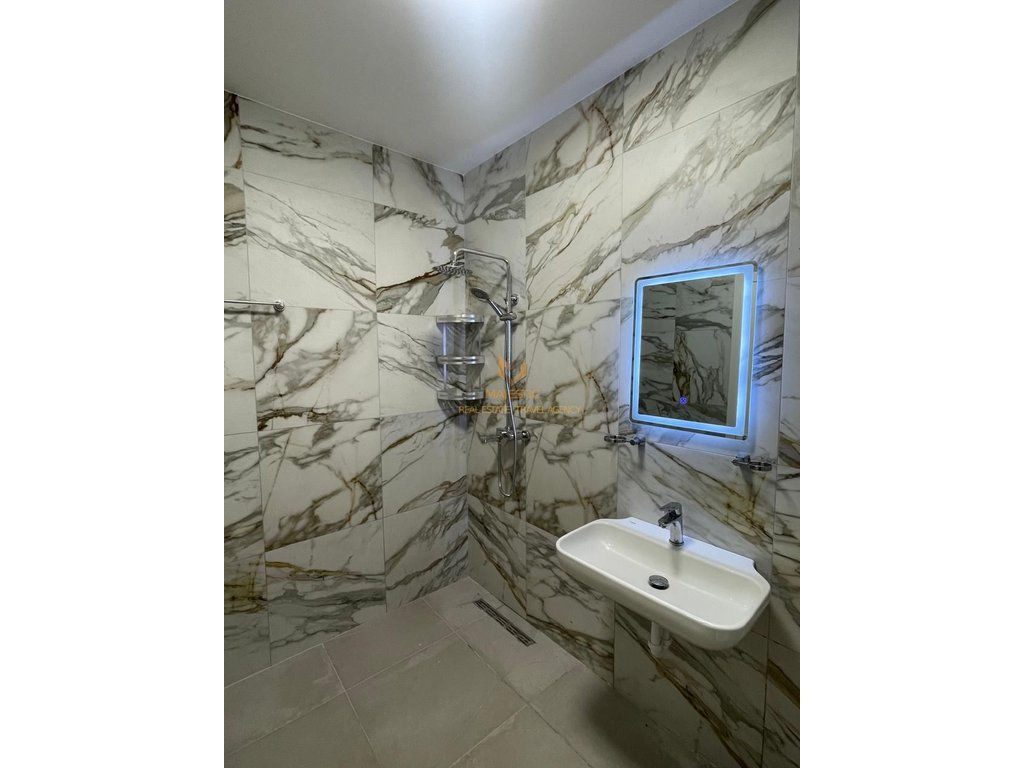 A 1+1 apartment is available for rent near the Red School.