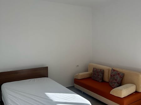 A 1+1 apartment with parking is available for rent on Konokozeve Street, porcelain.
