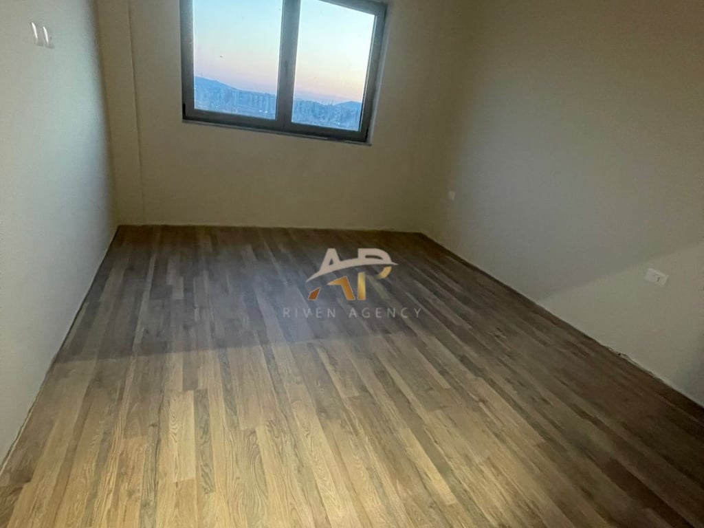 A 1+1 apartment is for rent, unfurnished, in a newly completed building.