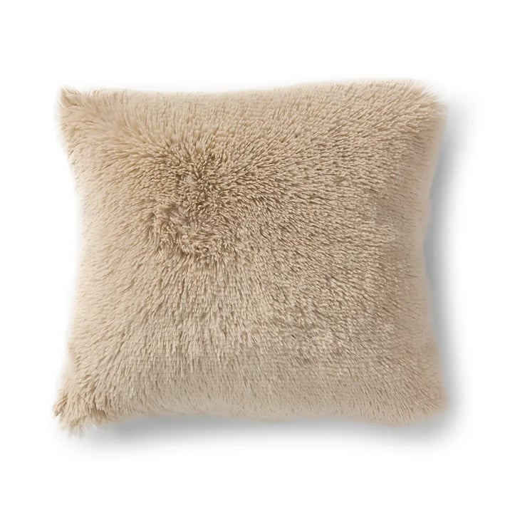 beige decorative cushion