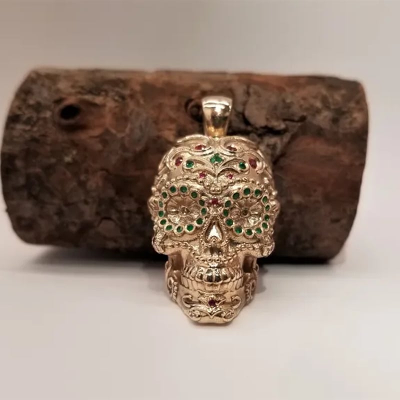 Custom gold and gemstone sugar skull pendant