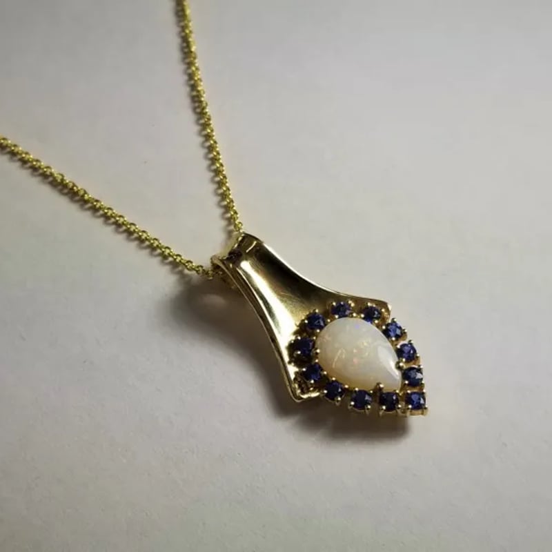 Custom pendant with opal and sapphires