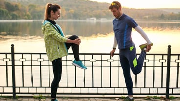 Young couple stretching before training