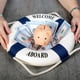 Piggy bank on Stacked dollars banknotes and lifebuoy with text Welcome on Board on wooden desk background Woman hands with life buoy Assets wealth money saving and security by insurance concept