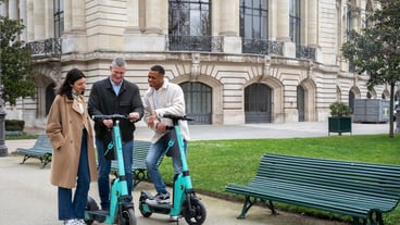 Adults learning to use electric scooter