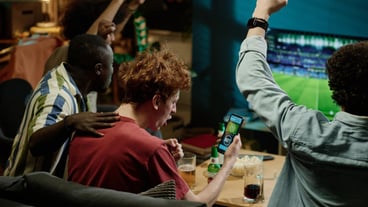 Happy Soccer Fans Watching Match On TV