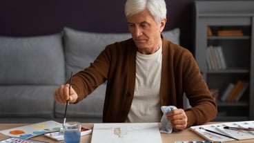 Senior painter using watercolor for his art