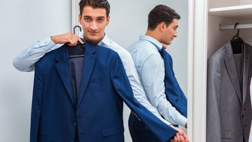 Businessman dressing up for work