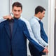 Businessman dressing up for work