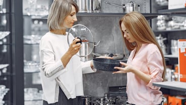 Woman buys dishes in the store