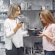 Woman buys dishes in the store