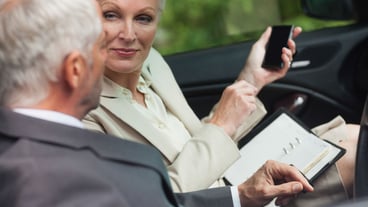 Business people talking together in classy cabriolet
