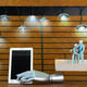 Close-up of electric lamp hanging on table
