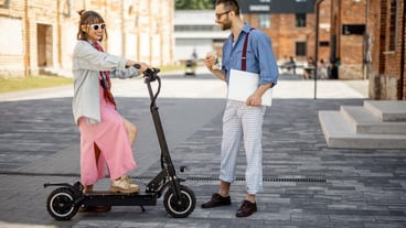 Stylish colleagues meet outdoors