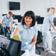 Group of workers clean modern office together at daytime