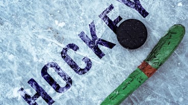 Hockey puck and stick on the ice texture, copyspace and text b