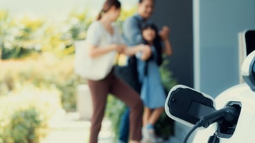 Focus home charging station for EV car blur progressive family in background