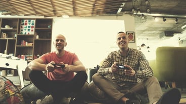 Work hard and play hard. Workers play computer games in the creative startup office