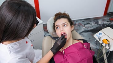 Young Female patient with pretty smile examining dental inspection at dentist clinic Healthy teeth