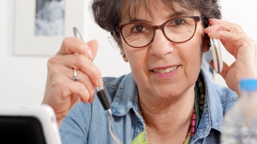 Mature woman using smartphone