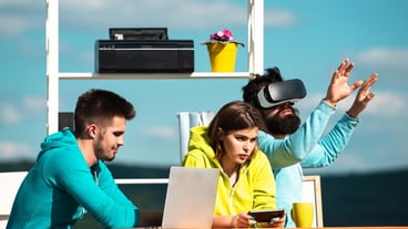Entrepreneurs working with virtual reality goggles during a virtual developer business meeting.