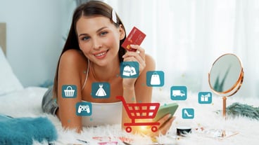 Consumer holding credit card typing phone shopping online inventory cybercash
