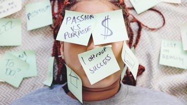 Black woman tired with sticky note on face motivation for success and money on bed African girl in bedroom stick idea in writing on skin and eyes for manifestation of dreams of house and wealth