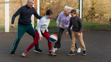 Full shot family playing basketball