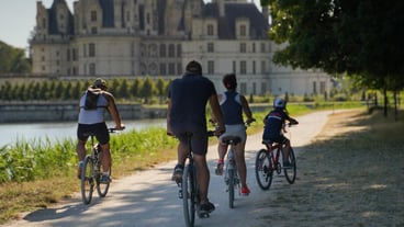 People riding bicycles on town square