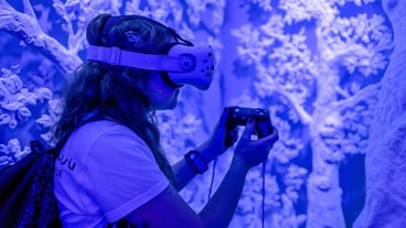 group of multicultural friends gamers with virtual reality glasses playing video games