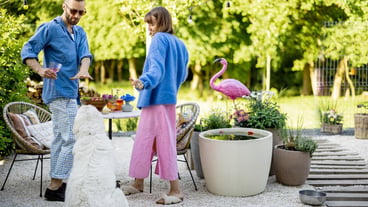 Stylish couple spends summertime in the backyard