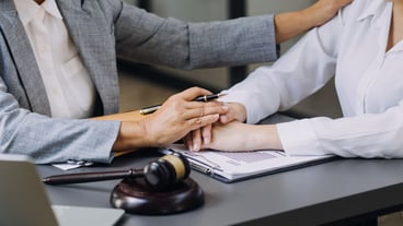 Justice and law conceptMale judge in a courtroom on wooden table and Counselor or Male lawyer working in office Legal law advice and justice concept