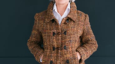 Trendy senior wardrobe. Female style and elegance. Aged lady posing in fashion tweed autumn outfit with hands in pockets.