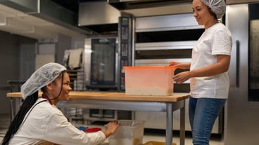 Side view women working in kitchen