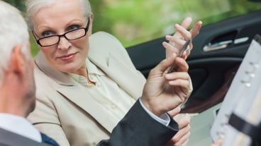 Business people talking together in cabriolet