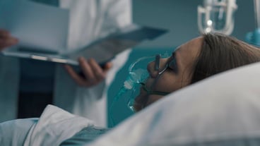Professional doctor assisting a patient and checking medical records