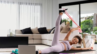 Full shot woman training at home