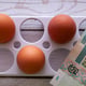 Chicken eggs on the background of banknotes