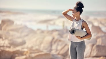Fitness exercise yoga mat and black woman at beach preparing for workout outdoors with mockup Zen mindfulness meditation and happy female from South Africa ready for pilates training at seashore