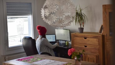 Young woman works from home in winter