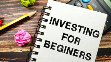 Business conceptText INVESTING FOR BEGINERS writing on notebook