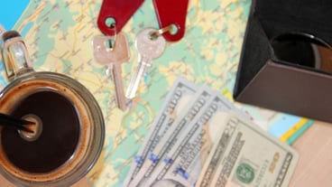 Passports Sunglasses Sunglasses Money and room keys Number on map Travel idea Cup of coffee before the trip