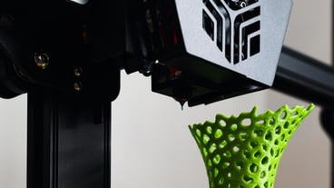 3D printer with a vase printed with Pla filament