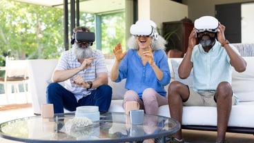 At home Diverse group of seniors using VR headsets enjoying virtual reality experience