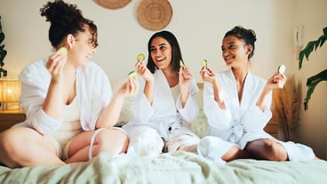 Cucumber skincare and friends with women in bedroom for beauty spa day and dermatology Facial natural cosmetics treatment and hotel resort with people for self care luxury and relax together