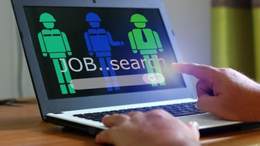 Worker using laptop searching new job